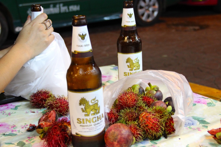 YUM! The beginning of our go-to snack for our entire trip- mangosteen, rambutan, and beer!